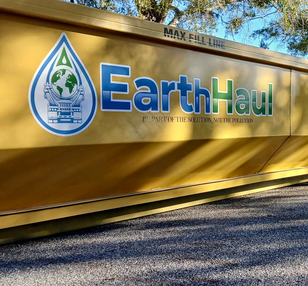 Roll-off dumpster near a metal project site in Bartow, FL.